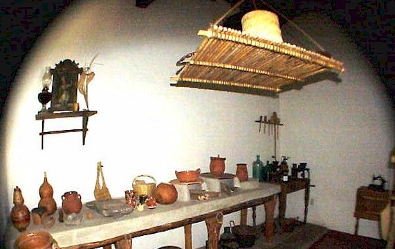 A rural kitchen of 100 years ago, with its tools and implements.