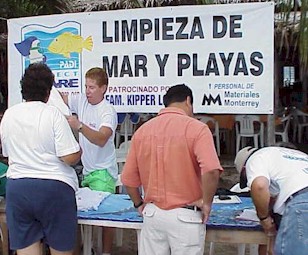 Dr. Lidia, organizer of the beach cleanup wait for her T-shirt