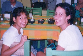 Yanira at age 14 with a volunteer